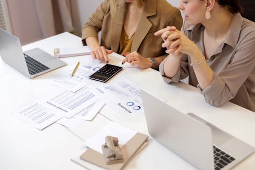 image of a person analyzing financial data on a computer