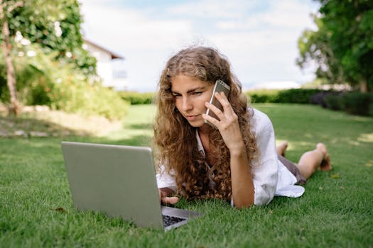 a person relaxing with a laptop outdoors