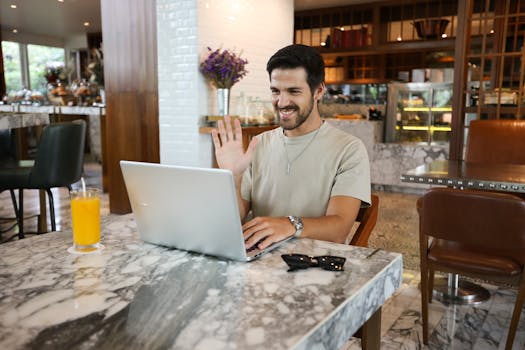 happy freelancer working at a café