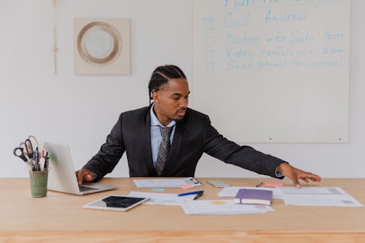 a checklist on a desk with a laptop