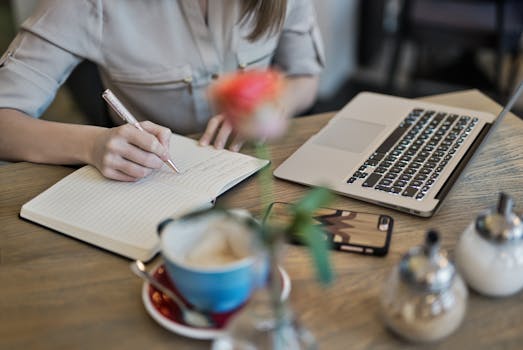 person working on a laptop in a coffee shop